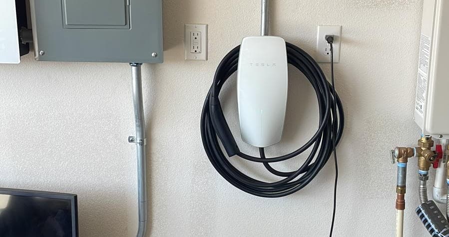 EV charger installed next to electrical panel