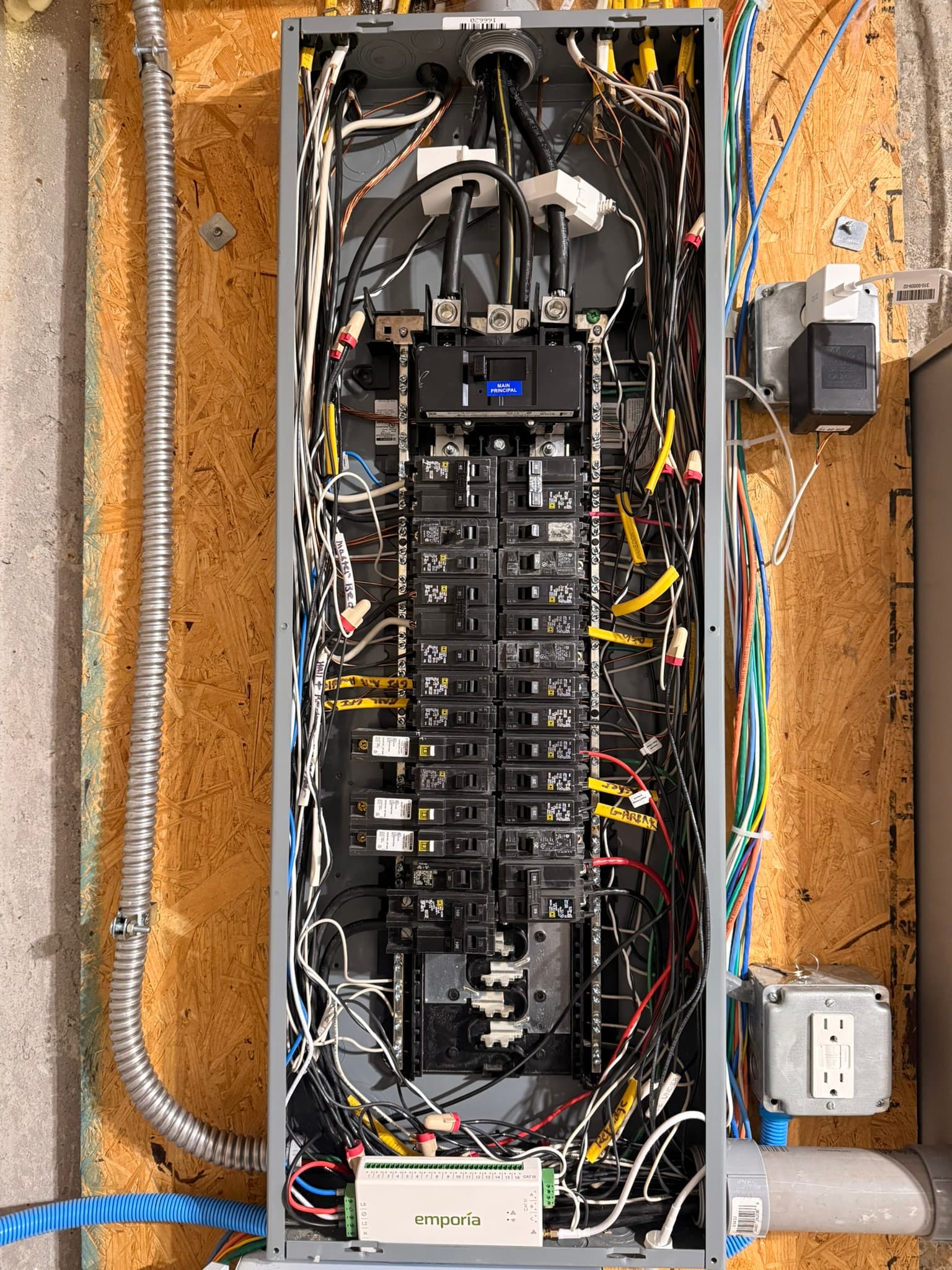 This charger came with a home energy monitoring system that we also installed. This allows David to monitor his power usage and for his car charger to reduce charging power as needed. This panel is more full than we would like it to be but this is how these systems get installed.