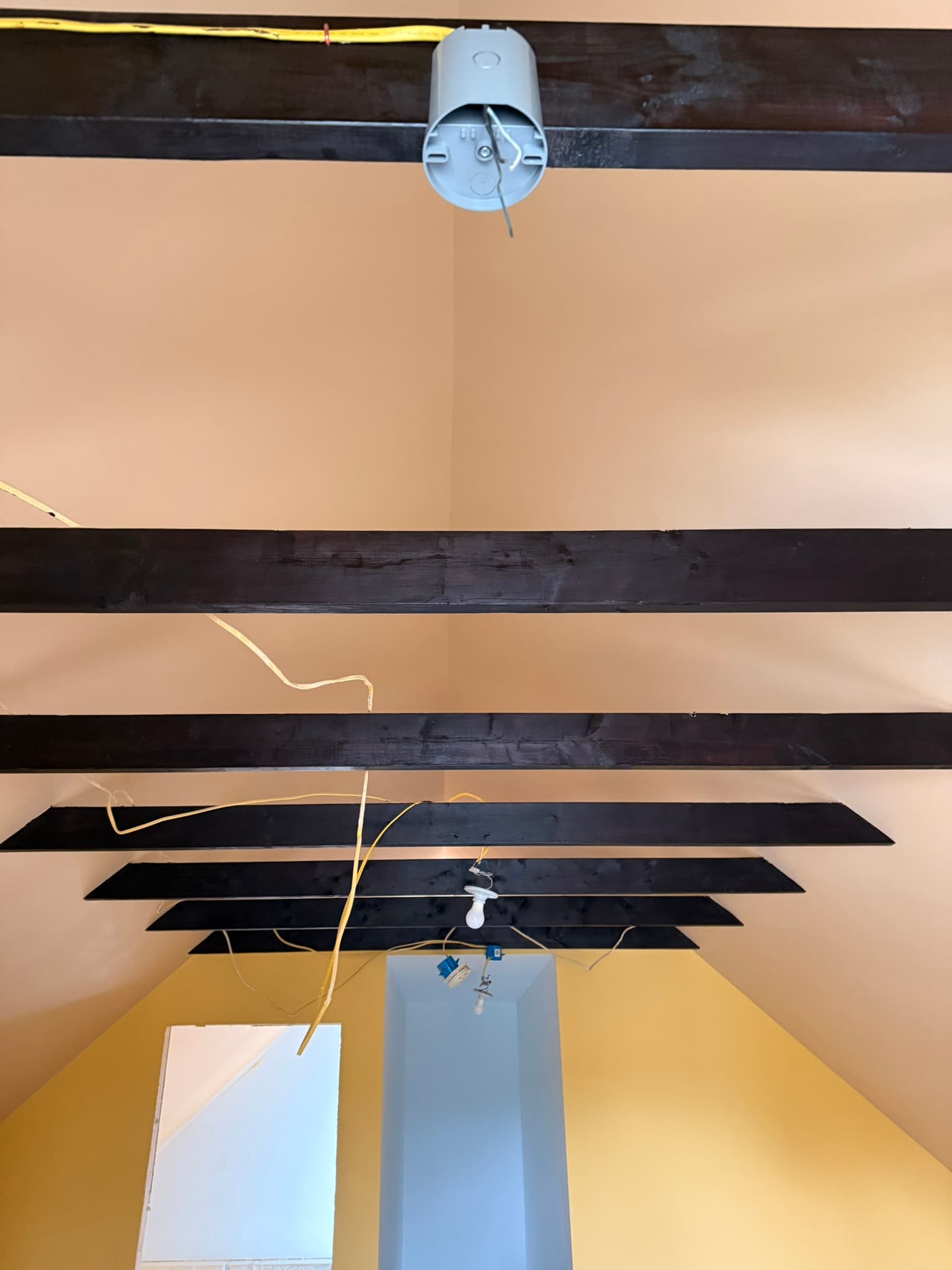 We Set all new boxes and tried to hide the wiring as best we could given that the space was finished and painted. This is a picture of one of our new boxes compared to what was there previously.