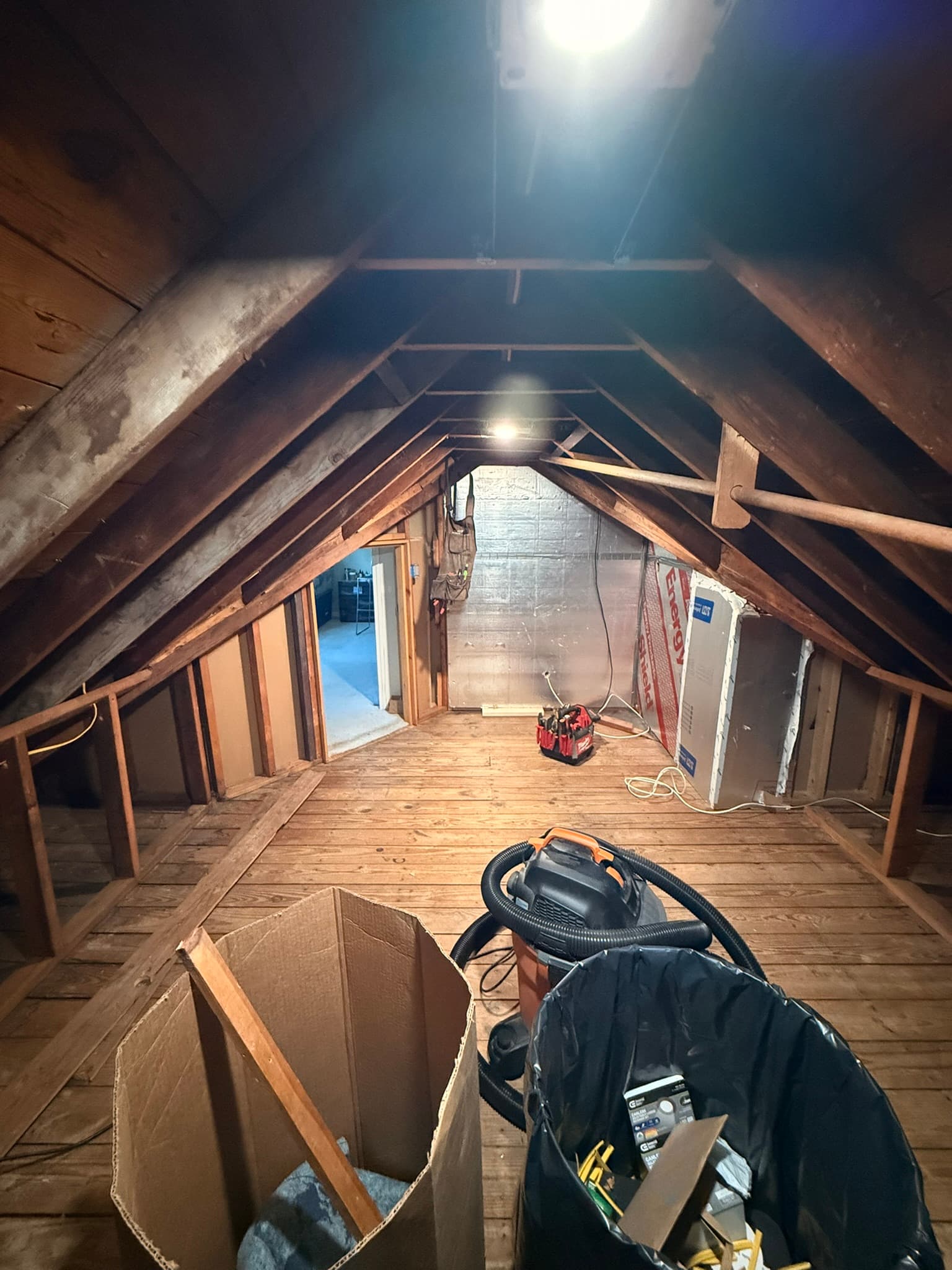 New lighting, dimmer switch, and outlets were installed to aid in the transformation of this attic space to a walk-in closet.